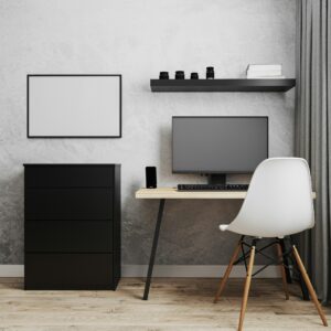 Blank frame near workplace with PC, wooden table and white chair, office workplace